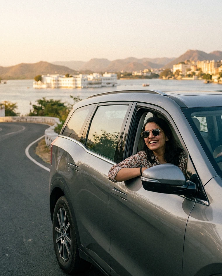A traveller enjoying a drive in a car booked on BaeCars